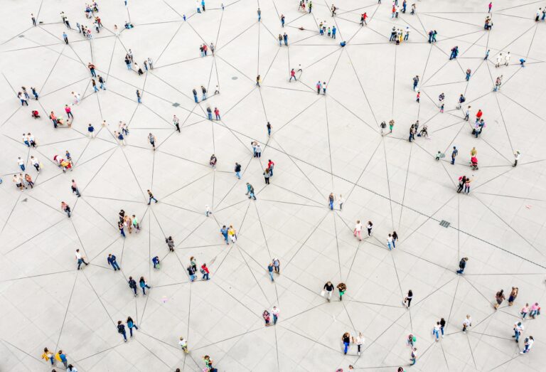 Aerial view of crowd connected by lines - Remedy Medical Properties